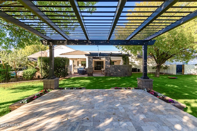 view of patio / terrace featuring exterior kitchen and a pergola