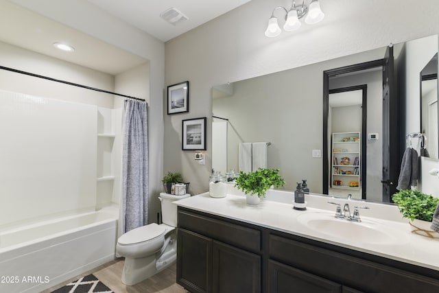 full bathroom with vanity, hardwood / wood-style flooring, toilet, and shower / bathtub combination with curtain