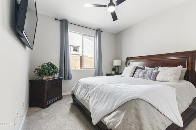 bedroom with light colored carpet and ceiling fan