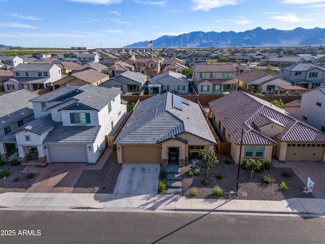 birds eye view of property featuring a mountain view