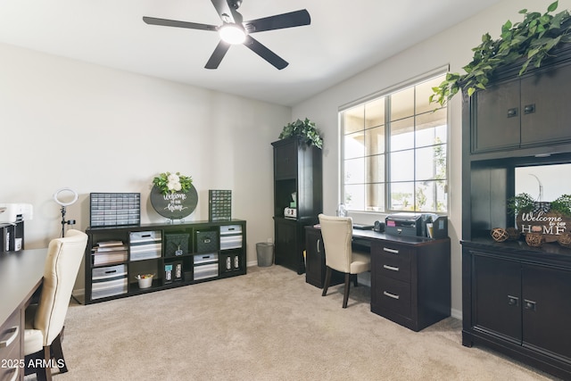 office space featuring light colored carpet and ceiling fan