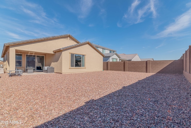 rear view of property with a patio area