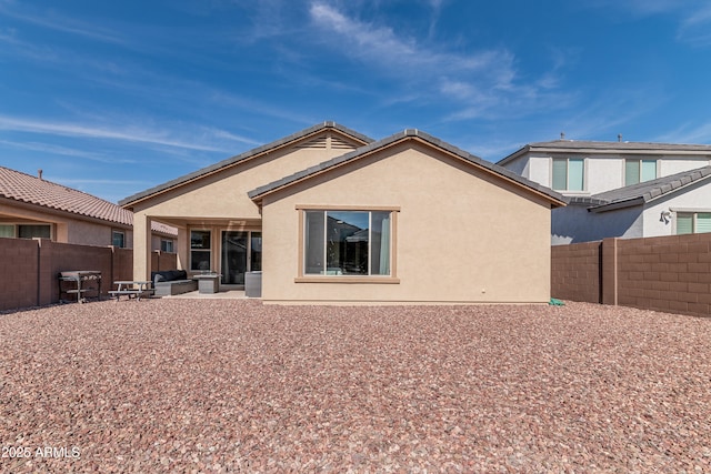 rear view of property featuring a patio