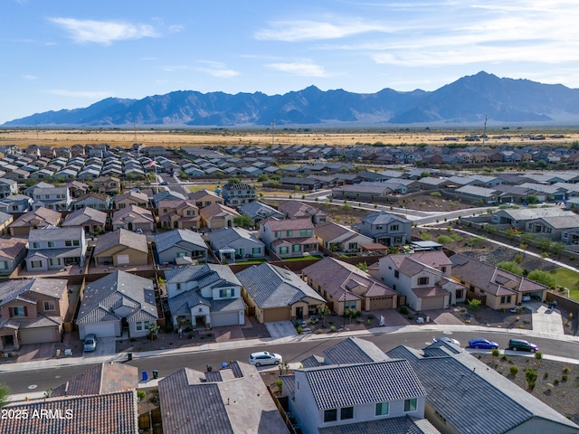 birds eye view of property with a mountain view