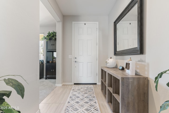 view of carpeted foyer