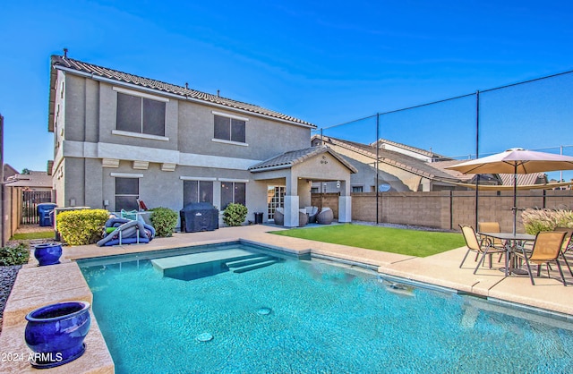 view of swimming pool with a patio area