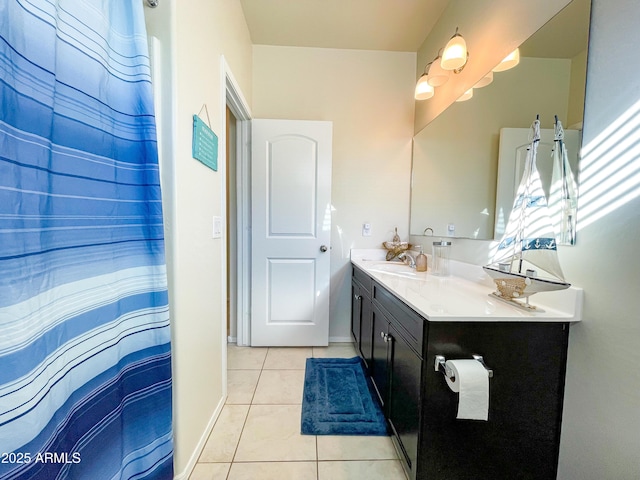 bathroom with tile patterned flooring and vanity