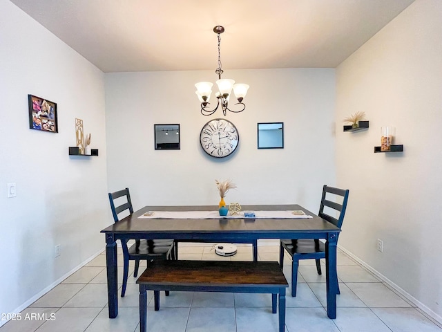 tiled dining room with a notable chandelier