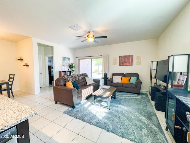 living room with ceiling fan and light tile patterned floors