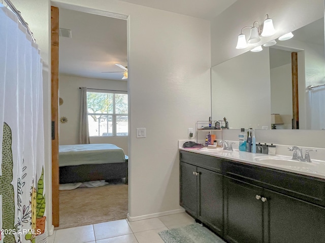 bathroom featuring ceiling fan with notable chandelier, vanity, and tile patterned floors