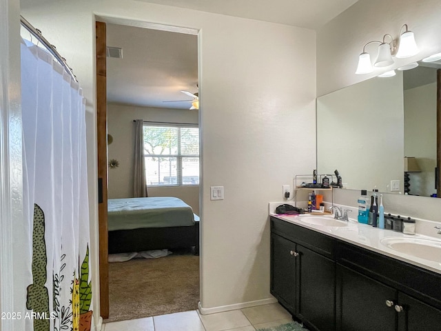 bathroom featuring ceiling fan, vanity, and tile patterned floors