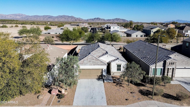 birds eye view of property with a mountain view