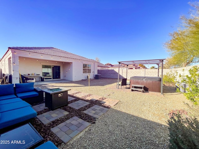 view of yard with a hot tub, a pergola, a patio, central AC unit, and an outdoor living space with a fire pit