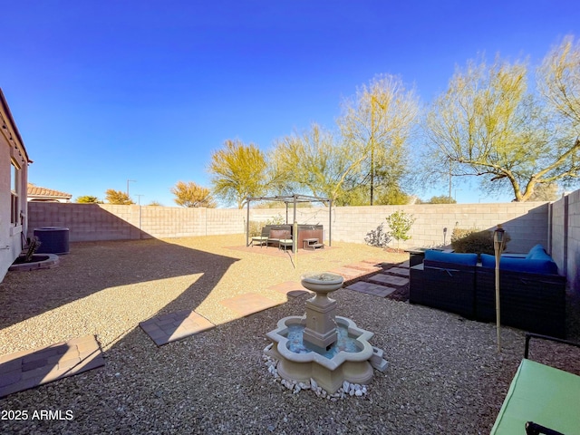 view of yard featuring an outdoor hangout area, a patio area, central AC unit, and a jacuzzi