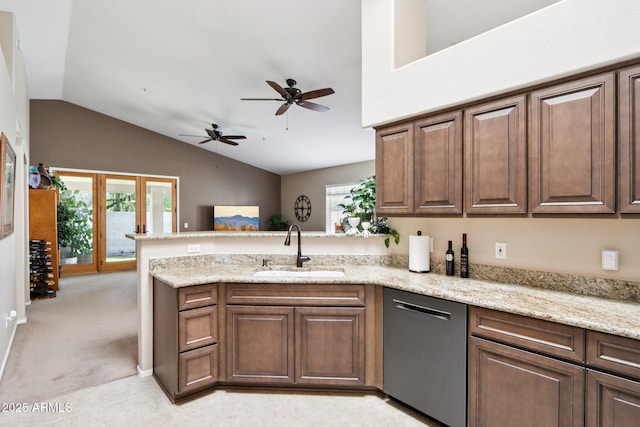 11861 E Becker Ln, Scottsdale, AZ 85259 - kitchen with stainless steel dishwasher, a peninsula, lofted ceiling, ceiling fan, and light stone counters