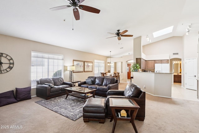 11861 E Becker Ln, Scottsdale, AZ 85259 - living area featuring light carpet, ceiling fan, and lofted ceiling