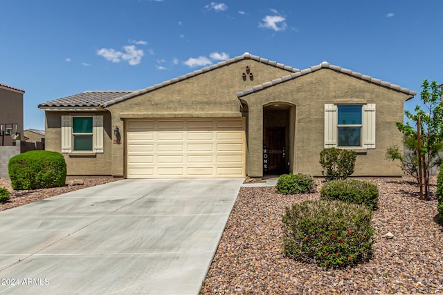 ranch-style home featuring a garage