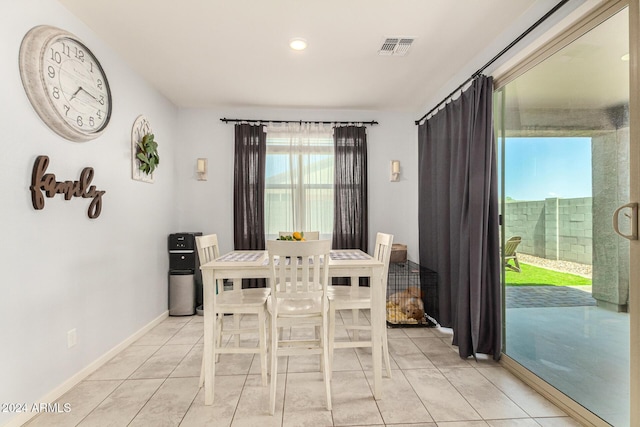 dining area with light tile patterned floors