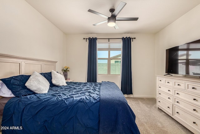 bedroom with light carpet and ceiling fan