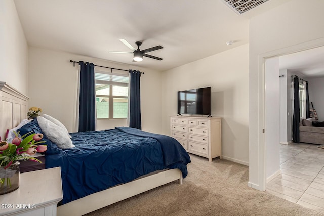 bedroom featuring ceiling fan and light colored carpet