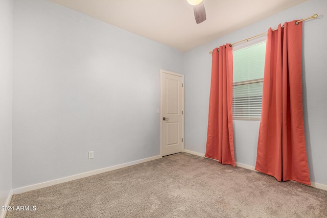 unfurnished room with light carpet and ceiling fan