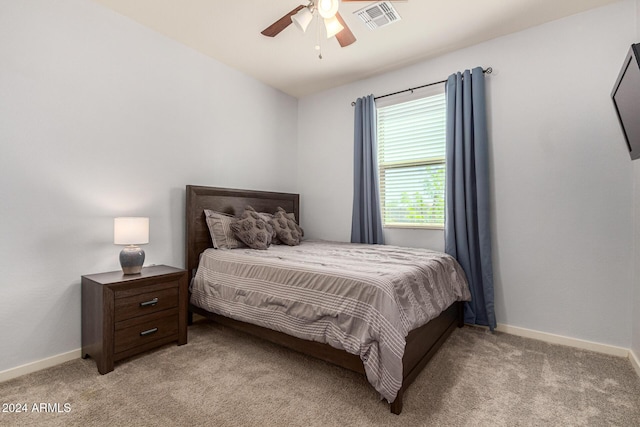 bedroom featuring ceiling fan and light carpet