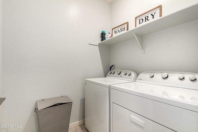 washroom featuring washing machine and clothes dryer