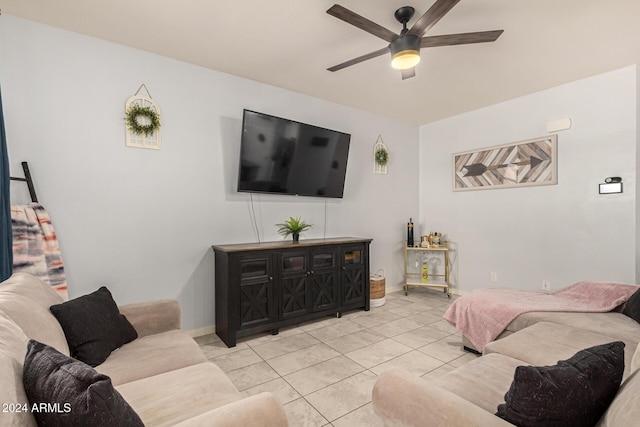 living room featuring ceiling fan and light tile patterned floors