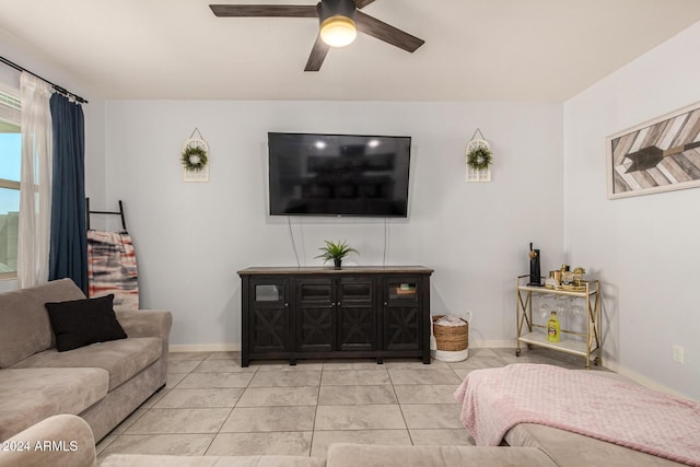 tiled living room with ceiling fan