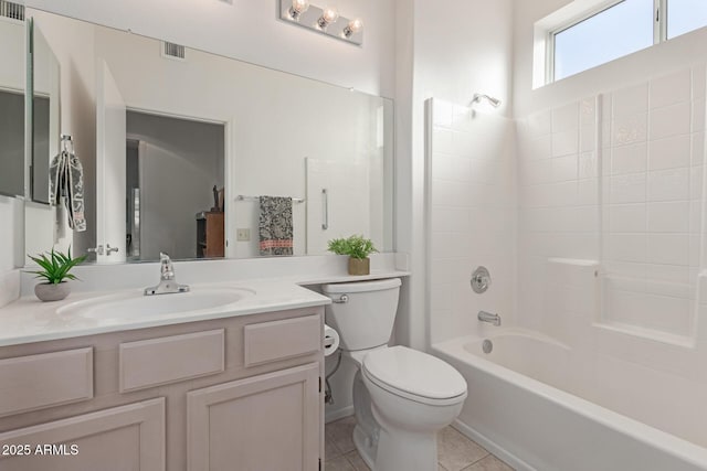 bathroom featuring toilet, visible vents, vanity, shower / bathing tub combination, and tile patterned floors