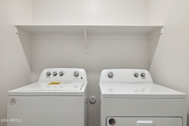 laundry area with washer and dryer and laundry area