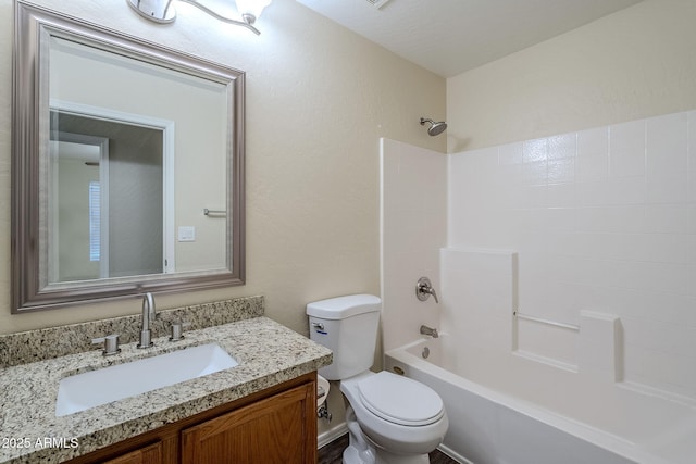 full bathroom with vanity, toilet, and washtub / shower combination