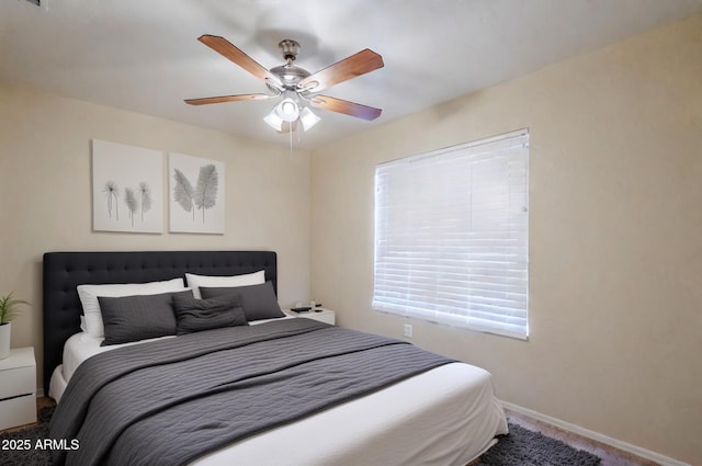 bedroom with ceiling fan and carpet