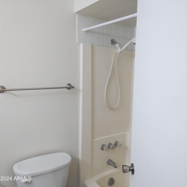 bathroom with shower / tub combination and toilet