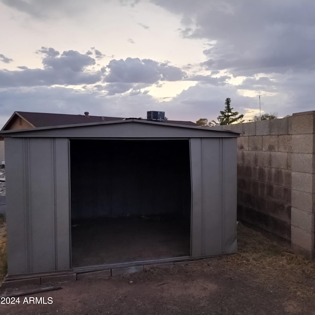 view of outdoor structure at dusk