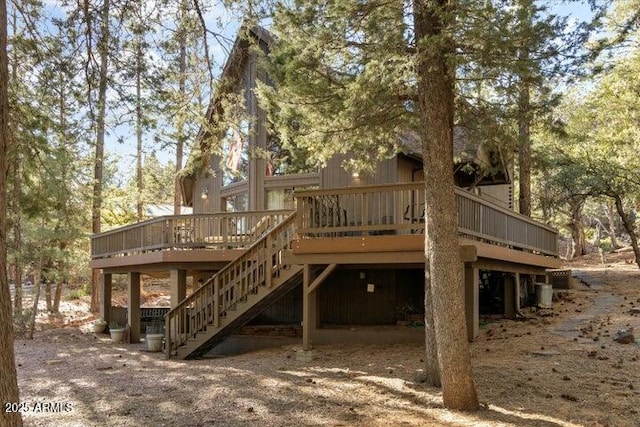 rear view of house featuring a deck