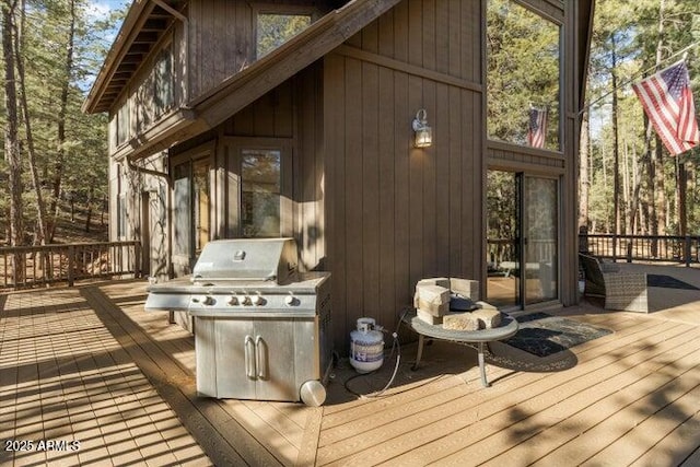 wooden deck with grilling area