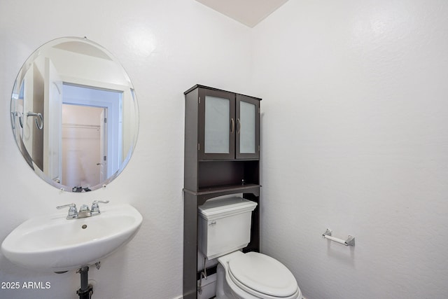 bathroom with a sink and toilet