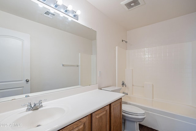 bathroom featuring toilet, tub / shower combination, vanity, and visible vents