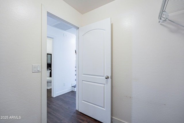 hall featuring visible vents and dark wood finished floors