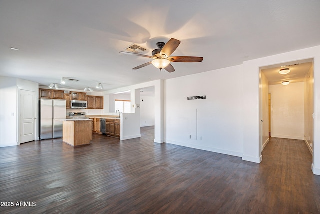 kitchen with visible vents, appliances with stainless steel finishes, light countertops, and dark wood-type flooring