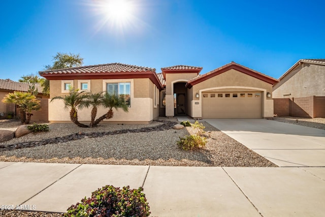 mediterranean / spanish-style home with a garage