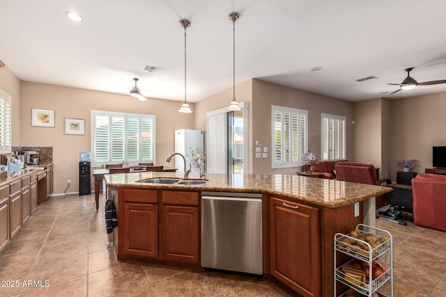 kitchen with sink, decorative light fixtures, ceiling fan, an island with sink, and stainless steel dishwasher