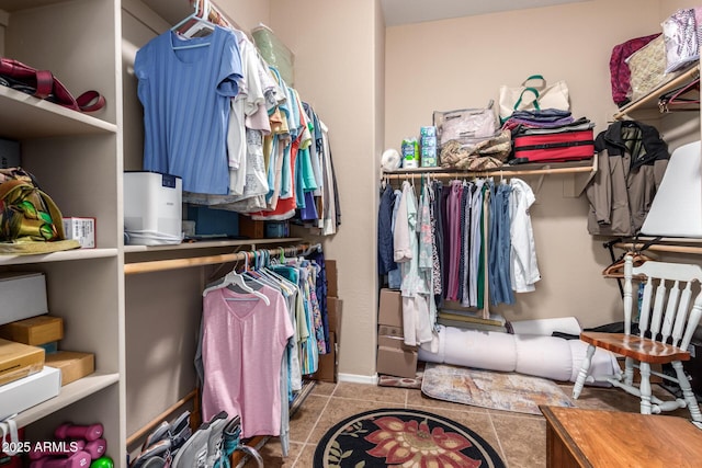 spacious closet featuring light tile patterned flooring