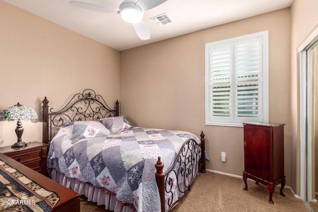 bedroom with ceiling fan and light colored carpet