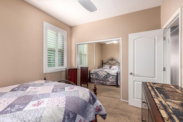 carpeted bedroom featuring ceiling fan