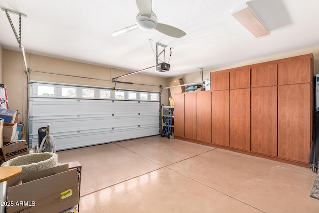 garage featuring ceiling fan and a garage door opener