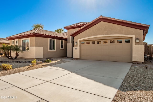 mediterranean / spanish-style home with a garage