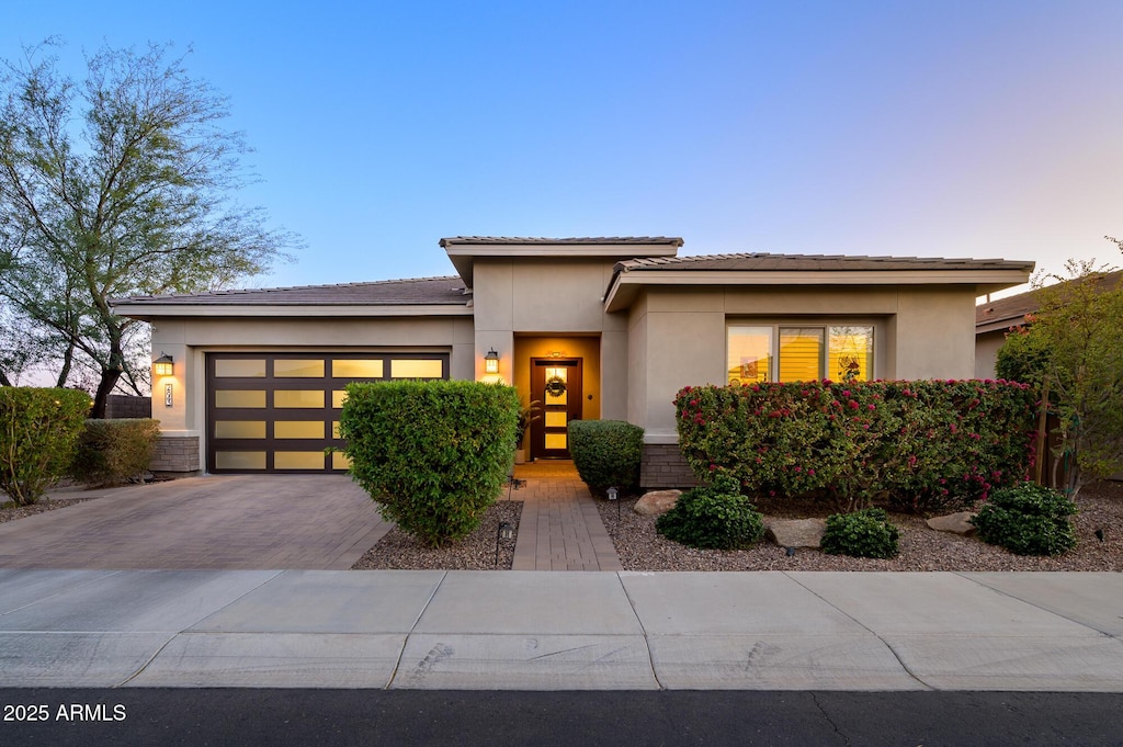 prairie-style house featuring a garage