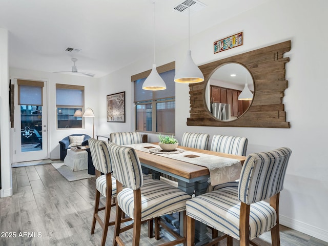2882 W Presidio Dr, Flagstaff, AZ 86001 - dining room with baseboards, ceiling fan, visible vents, and wood finished floors